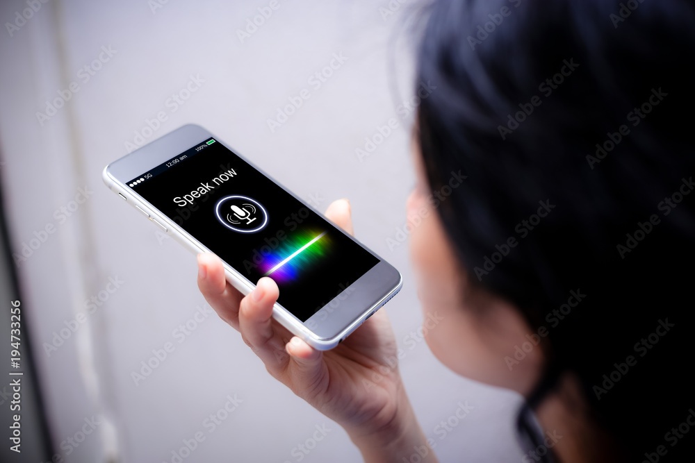 Voice recognition,search technology concept.Close-up of woman talking on her mobile phone