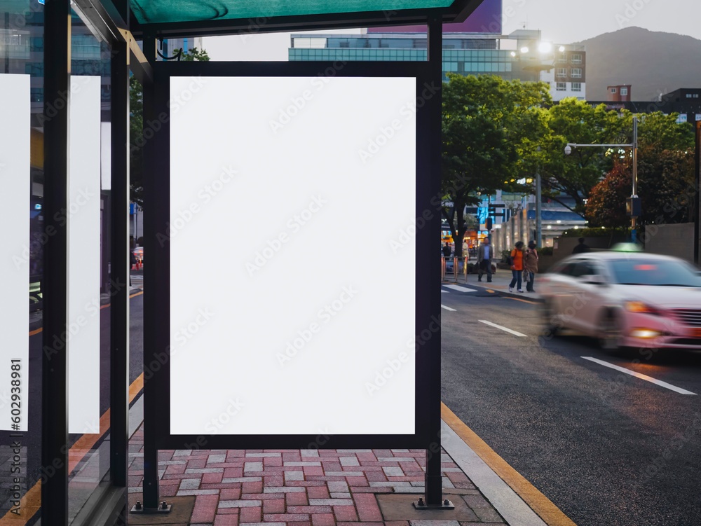 Blank white mock up Media Advertisement at bus stop City street