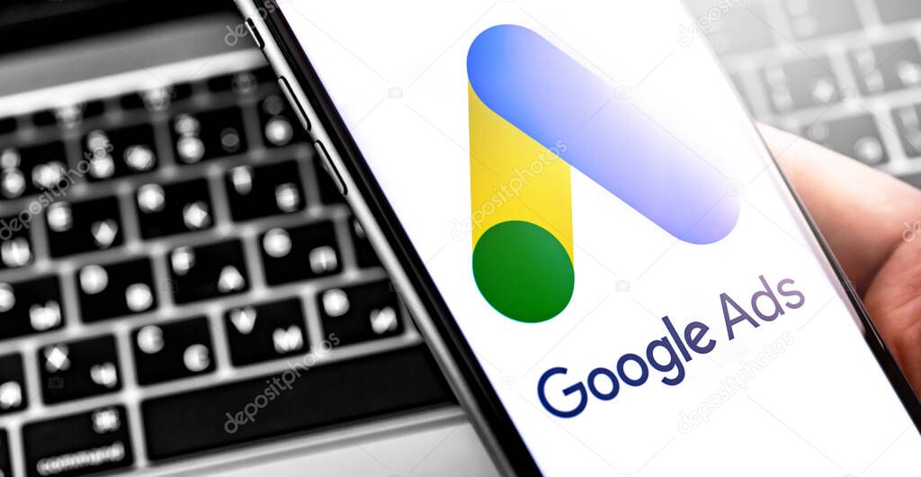 Google Ads symbol on the screen smartphone and notebook background. Ads is a service of contextual, basically, search advertising from Google. Moscow, Russia - September 20, 201