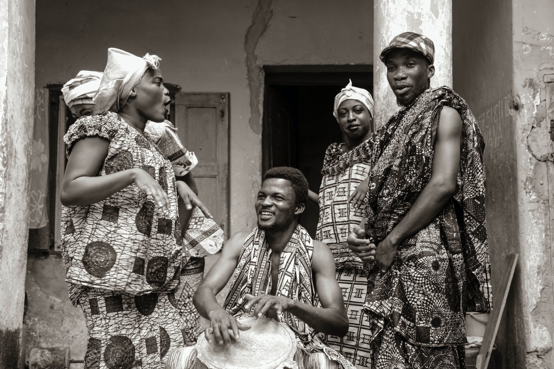 grayscale photo of people wearing traditional clothes