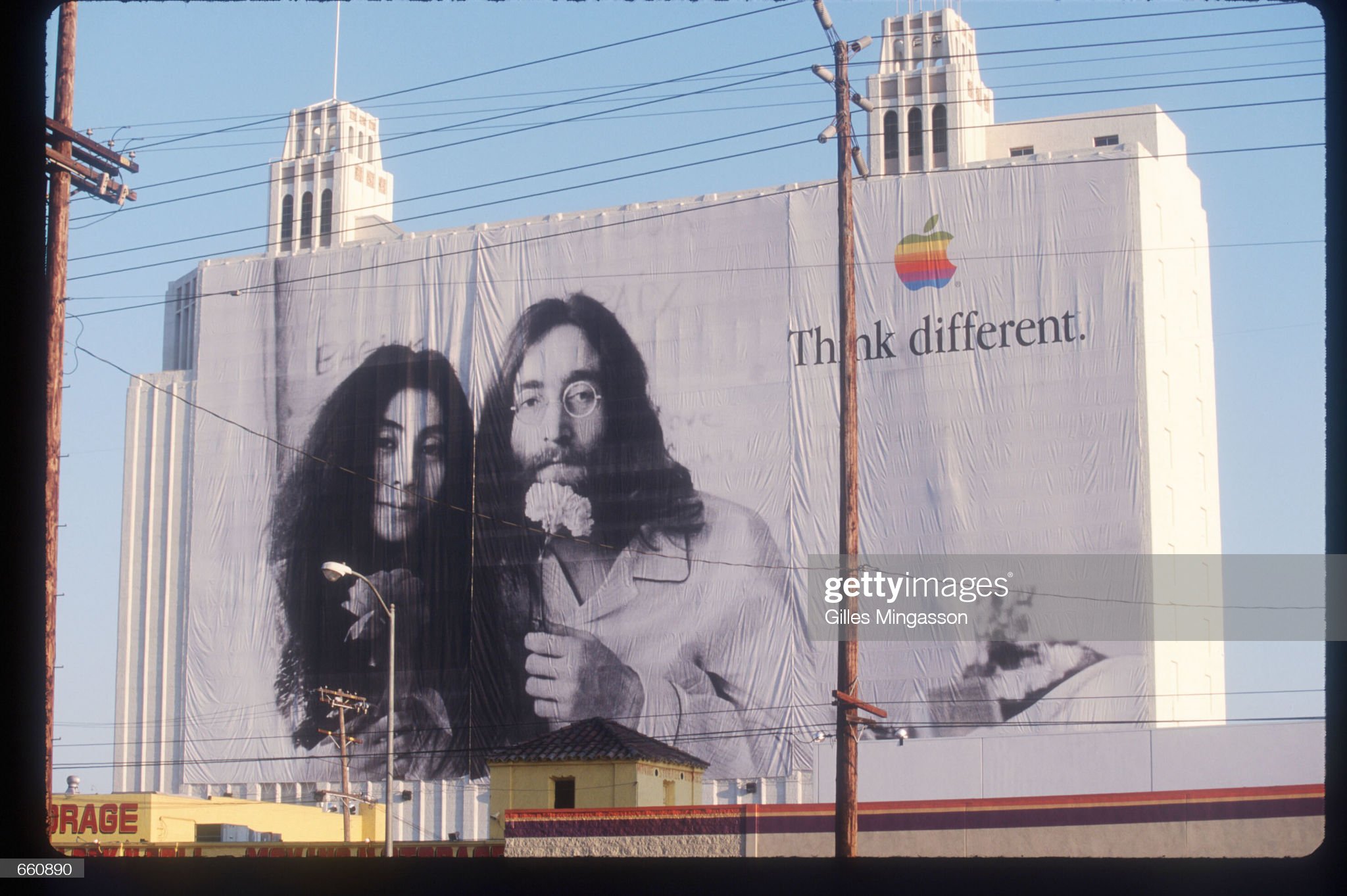 336169 02: A billboard depicting John Lennon and Yoko Ono promotes Apple Computers August 1, 1998 in Los Angeles, CA. Numerous famous and historical figures are featured in a series of Apple Computer's "Think Different" advertisements including Picasso, Muhammad Ali, Ted Turner and the Dalai Lama. (Photo by Gilles Mingasson/Liaison)