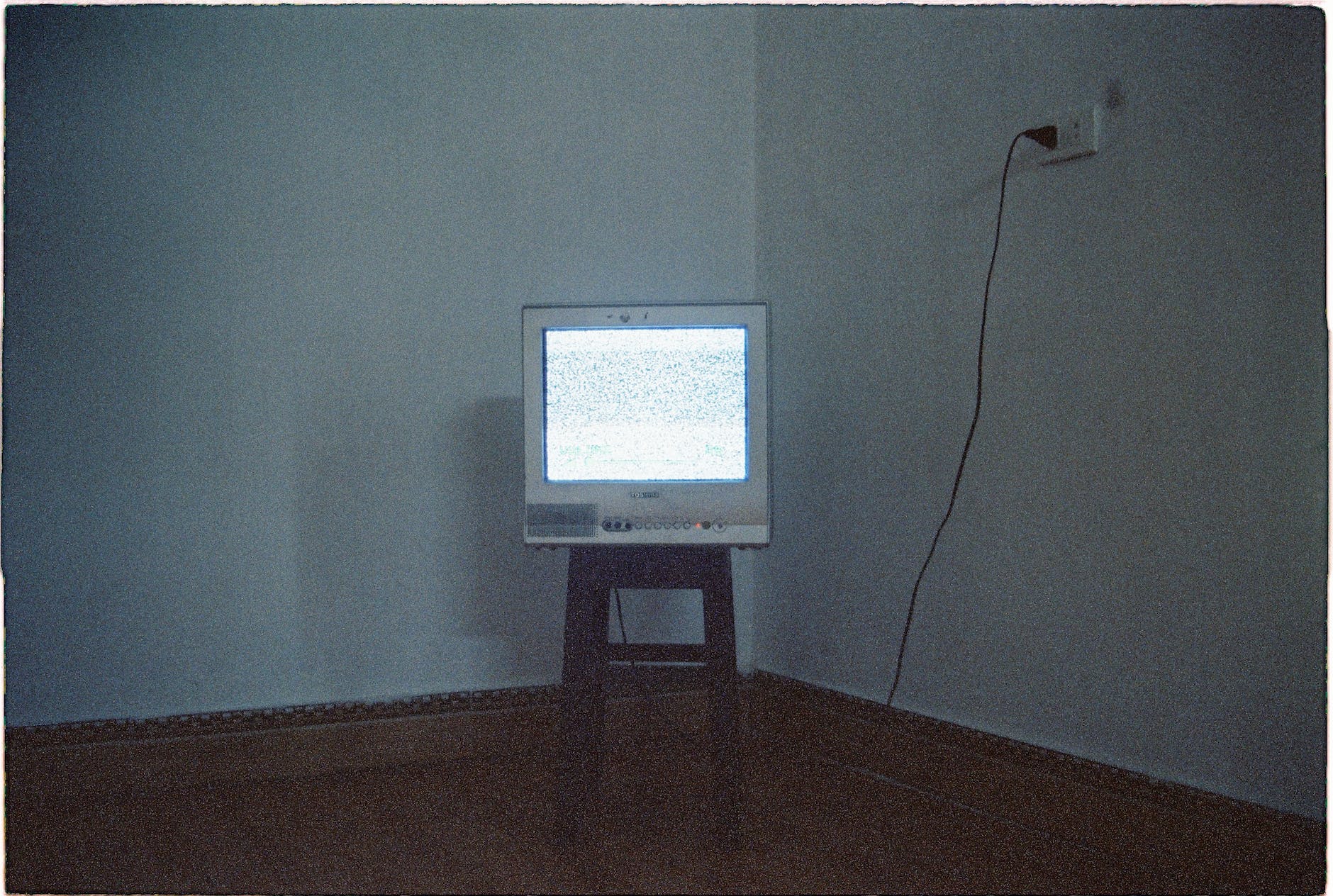 tv on chair in corner